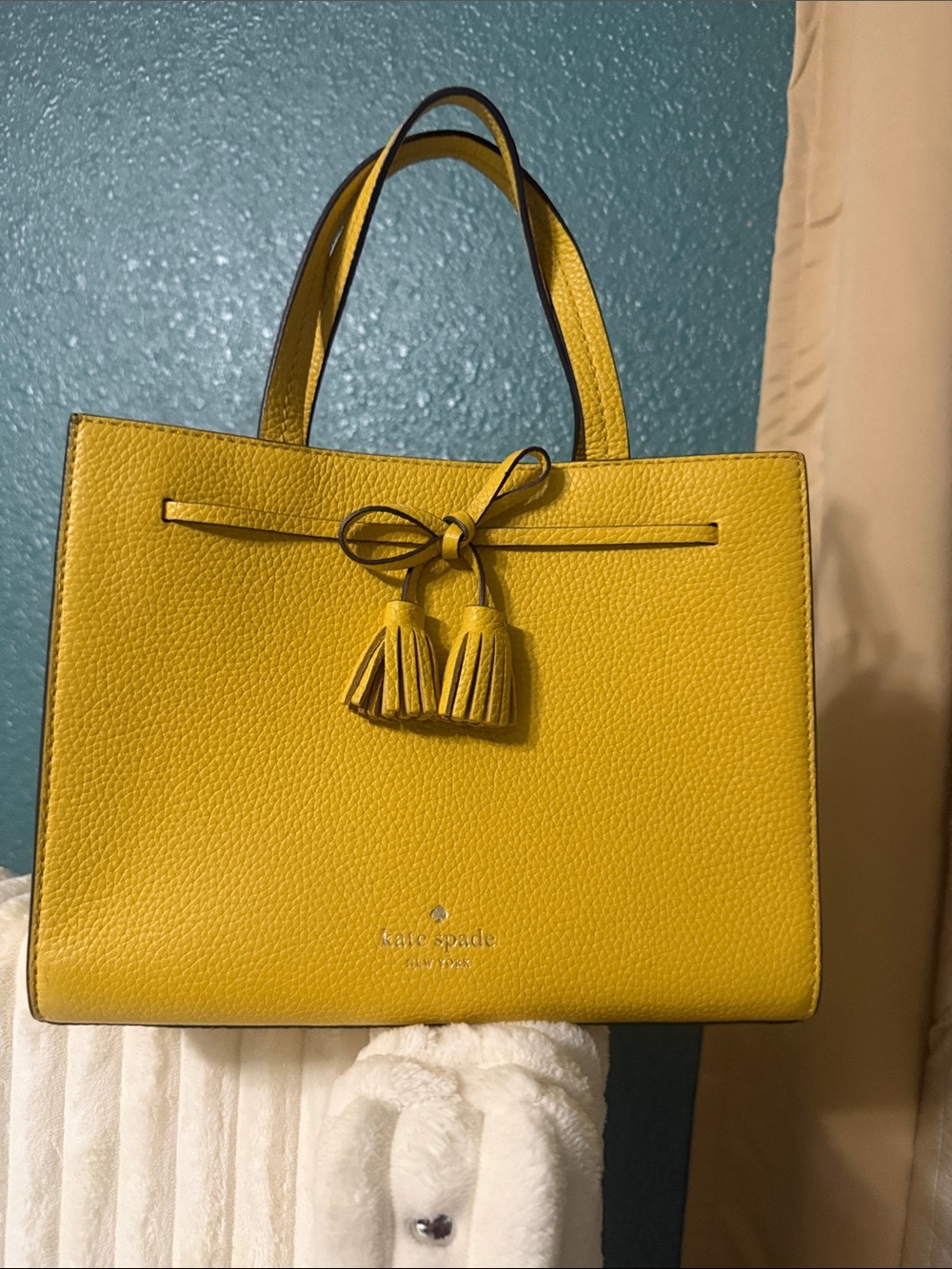 kate spade Yellow Pebbled Leather Tote with bow & Tassel Accent.